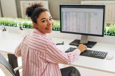 smiling-accountant-working-with-spreadsheet-softwa-2025-01-07-18-49-58-utc.jpeg